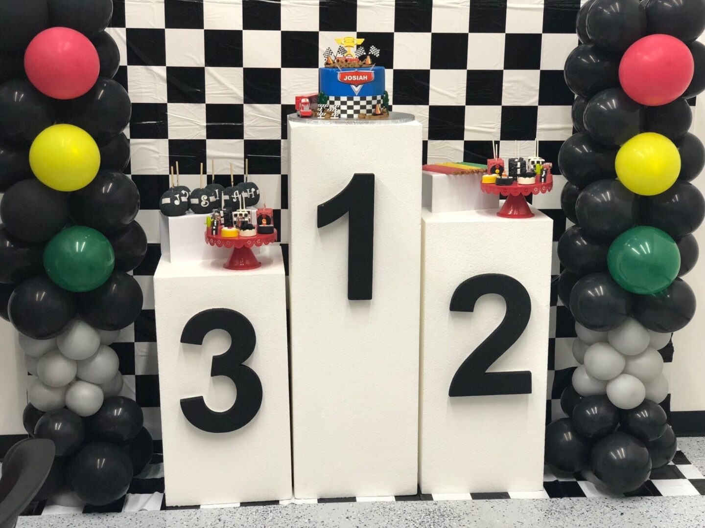 A podium with three different levels and balloons