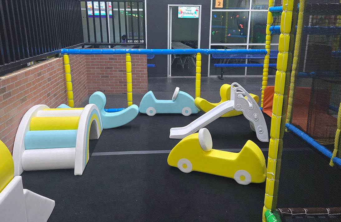 Children's indoor playground with slides and rockers