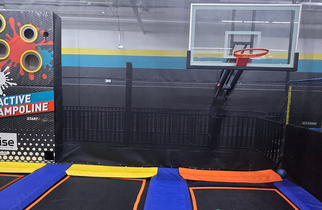 Fun park with trampolines and basketball.