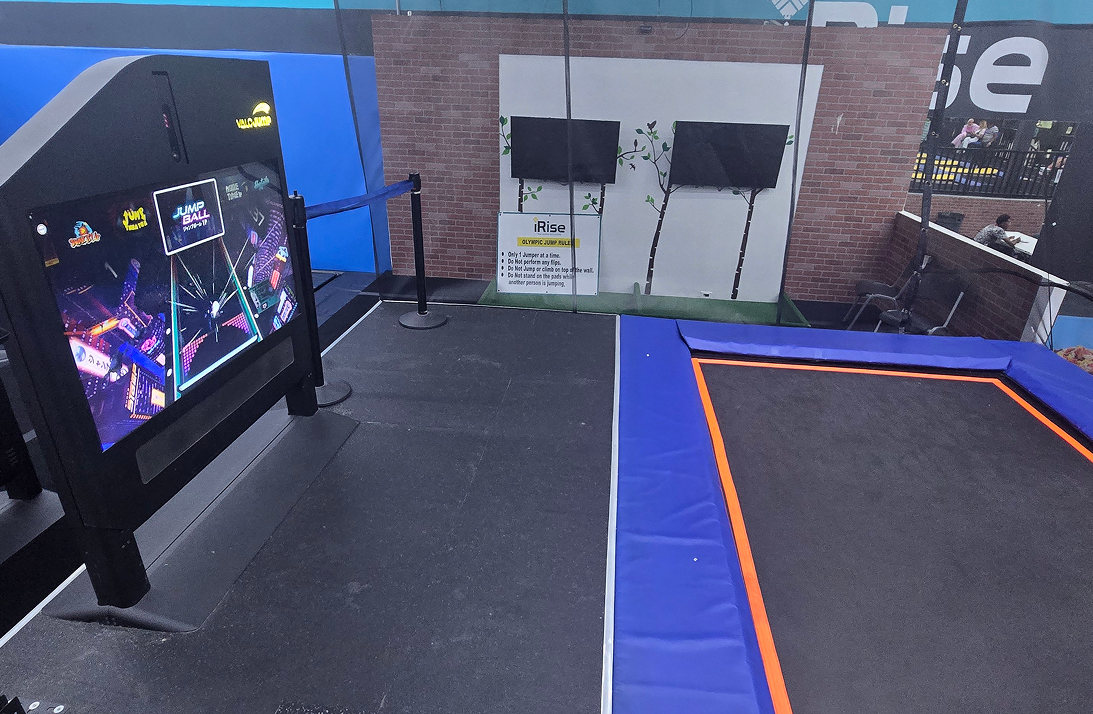 Trampoline park with interactive game and screens