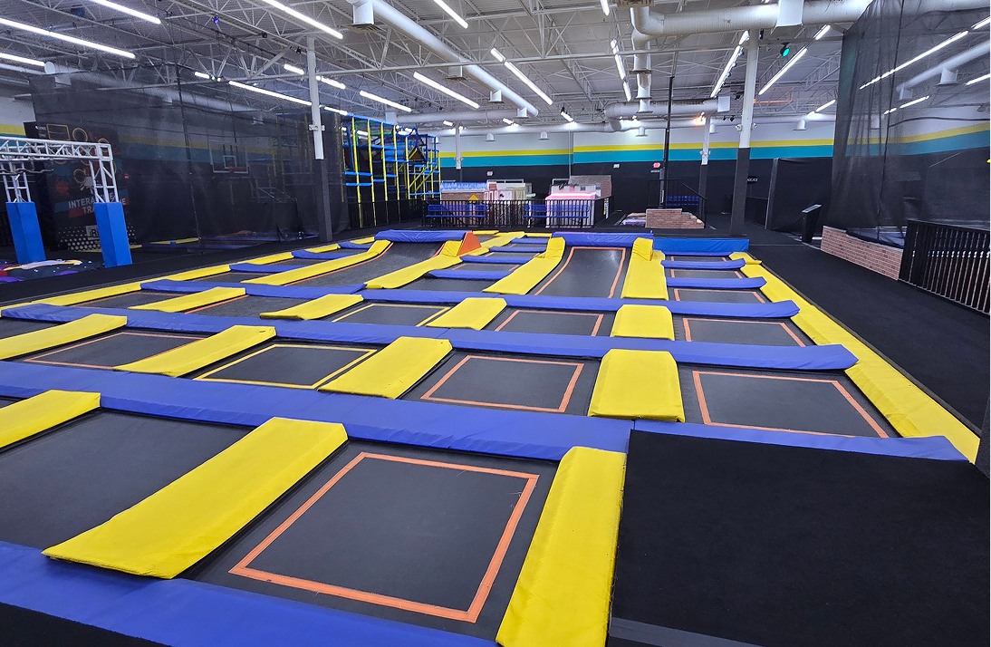 Empty trampoline arena with various jump zones
