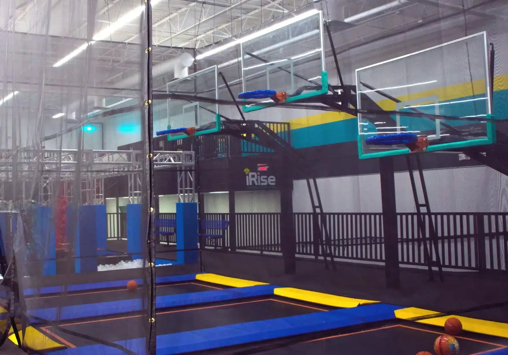 A trampoline park with several different types of trampolines.